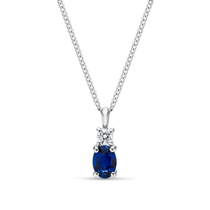 Oval Cut Sapphire and Diamond Pendant in White Gold