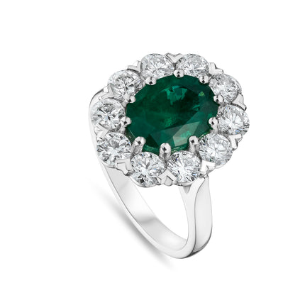 Oval Cut Emerald and Diamond Cluster Ring in Platinum